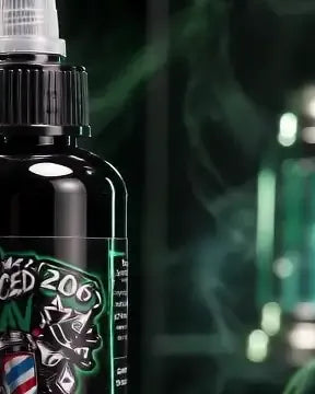 The Enhanced By Rav 206 BLACK bottle on a lit podium